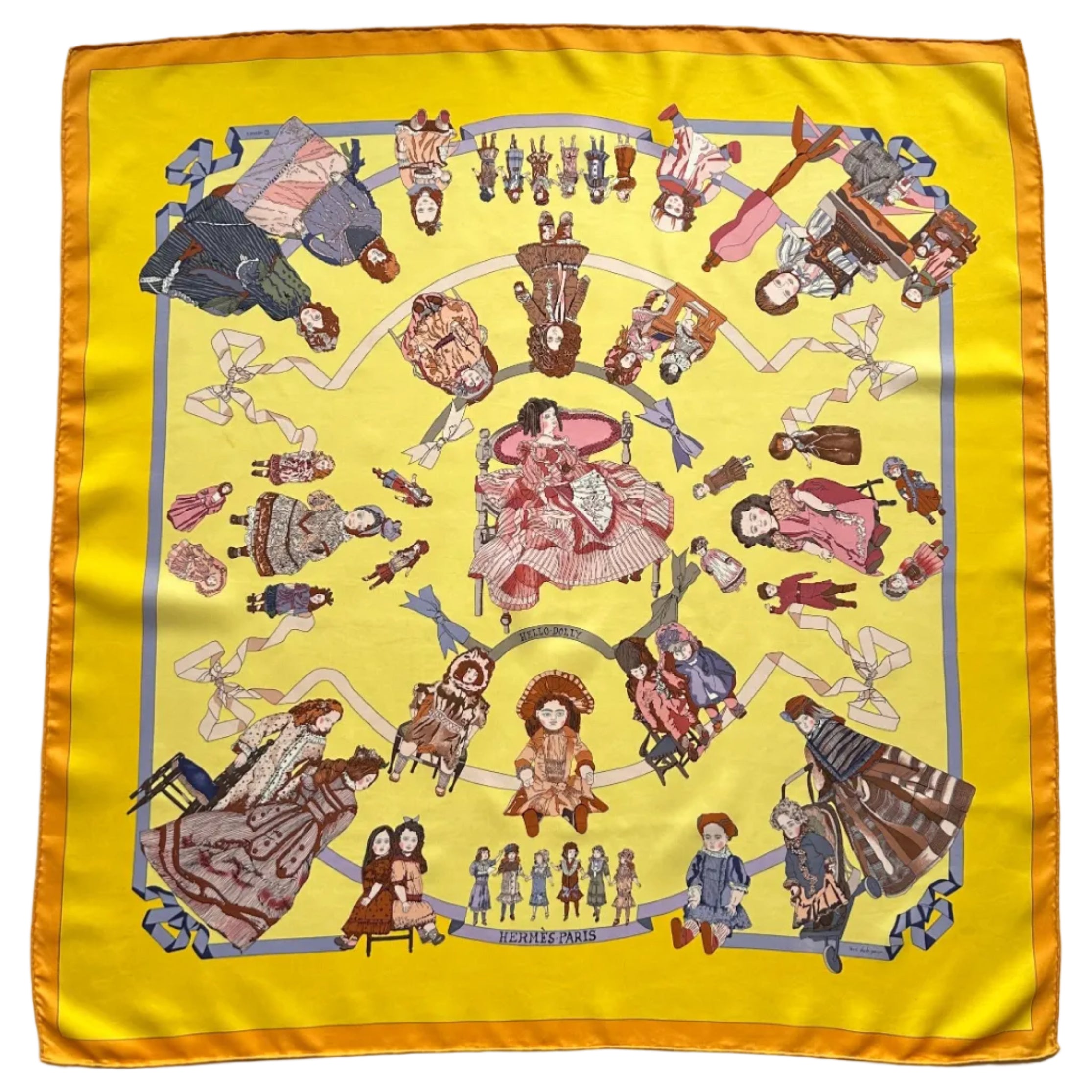 Carré Hermès "Hello Dolly" vintage (1990) déployé, fond jaune vif bordé d'orange, motif circulaire de poupées anciennes.